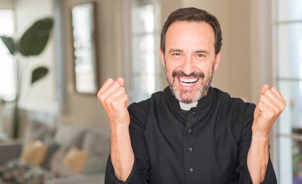Christian priest man screaming proud and celebrating victory and success very excited, cheering emotion