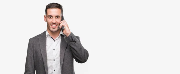 Hombre Joven Guapo Usando Teléfono Inteligente Con Una Cara Feliz — Foto de Stock