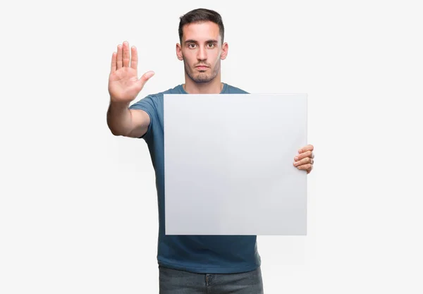 Handsome Young Man Holding Advertising Banner Open Hand Doing Stop — Stock Photo, Image