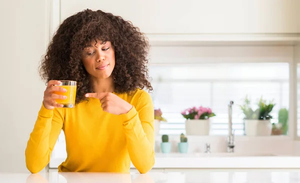 African American Woman Drinking Orange Juice Glass Very Happy Pointing — Stock Photo, Image