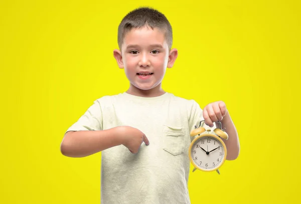 Little Child Holding Alarm Clock Surprise Face Pointing Finger Himself — Stock Photo, Image