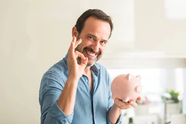 Middle Age Man Money Piggy Bank Doing Sign Fingers Excellent — Stock Photo, Image