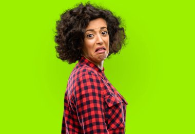 Beautiful arab woman feeling disgusted with tongue out clipart