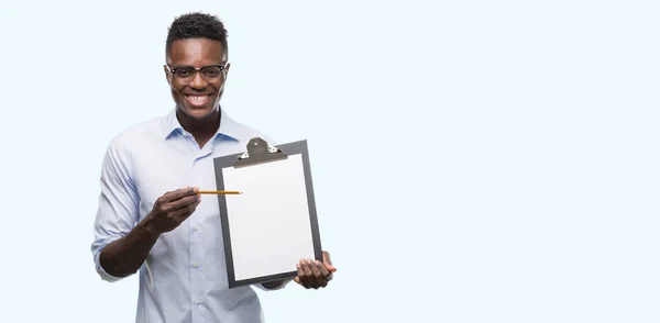Young African American Man Holding Clipboarad Happy Face Standing Smiling — Stock Photo, Image