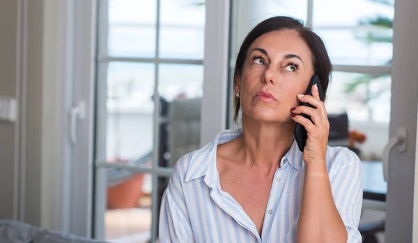 Middle Aged Woman Using Smartphone Serious Face Thinking Question Very — Stock Photo, Image