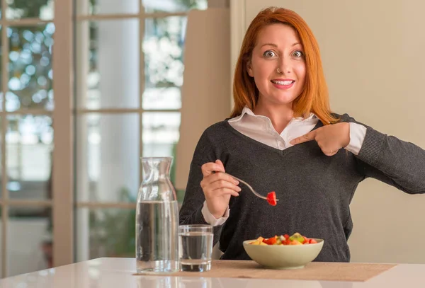 Redhead Woman Eating Fruit Bowl Kiwi Strawberry Home Surprise Face — Stock Photo, Image