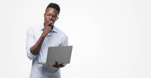 Young African American Businessman Using Computer Laptop Serious Face Thinking — Stock Photo, Image