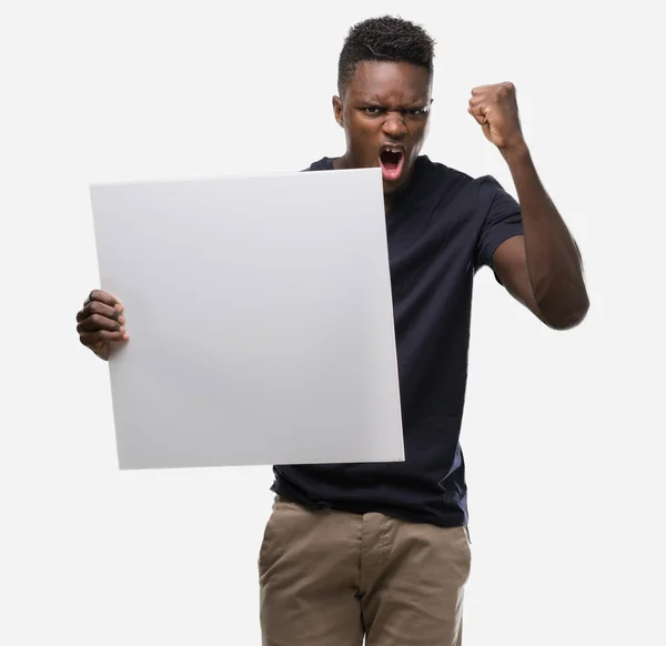 Young African American Man Holding Banner Annoyed Frustrated Shouting Anger — Stock Photo, Image