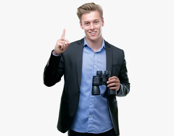 Young Handsome Blond Man Looking Binoculars Surprised Idea Question Pointing — Stock Photo, Image