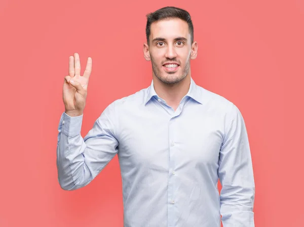 Handsome Young Businessman Showing Pointing Fingers Number Three While Smiling — Stock Photo, Image