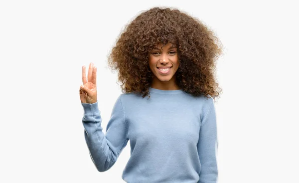 African American Woman Wearing Sweater Showing Pointing Fingers Number Three — Stock Photo, Image
