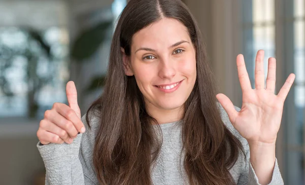 Young Beautiful Woman Home Showing Pointing Fingers Number Six While — Stock Photo, Image