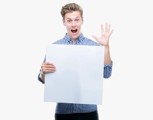 Young Handsome Blond Man Holding Banner Very Happy Excited Winner — Stock Photo, Image