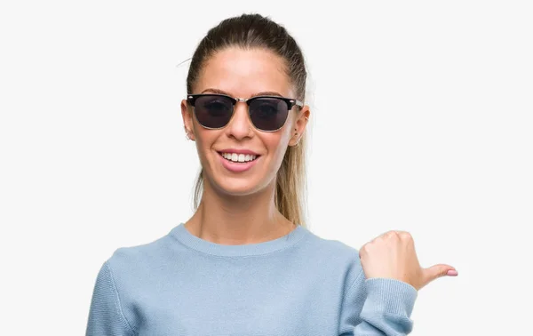 Beautiful Young Woman Wearing Sunglasses Ponytail Pointing Hand Finger Happy — Stock Photo, Image