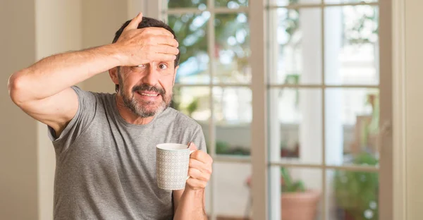 Middle Age Man Drinking Coffee Cup Stressed Hand Head Shocked — Stock Photo, Image