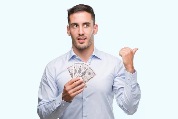 Handsome Young Man Holding Money Pointing Hand Finger Happy Face — Stock Photo, Image