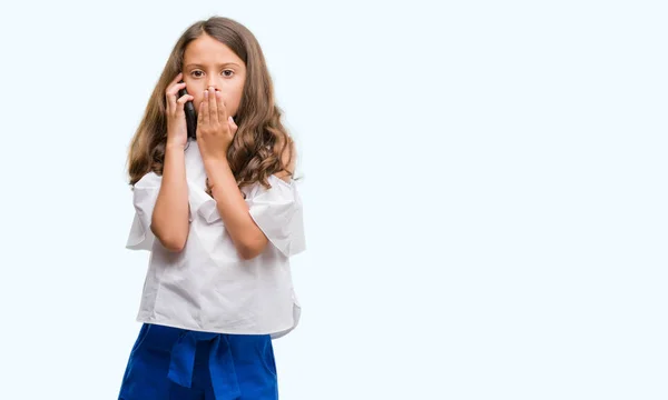 Brunette Hispanic Girl Using Smartphone Cover Mouth Hand Shocked Shame — Stock Photo, Image