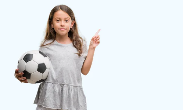 Morena Hispânica Menina Segurando Bola Futebol Muito Feliz Apontando Com — Fotografia de Stock