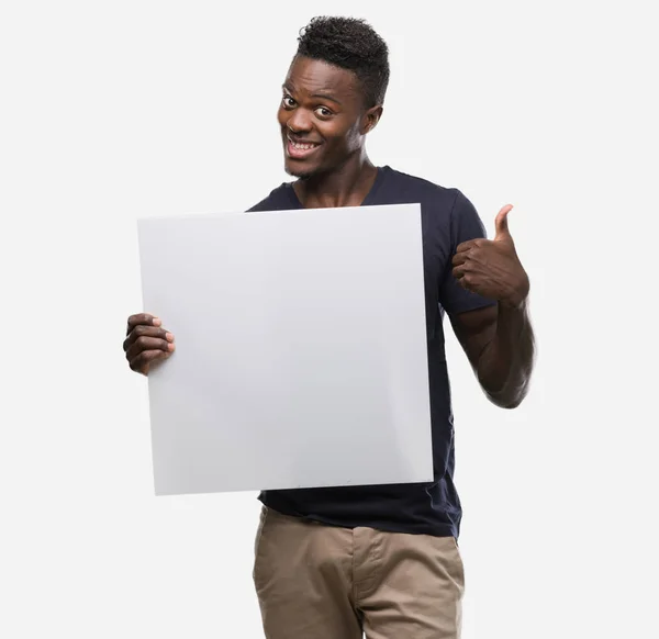 Young African American Man Holding Banner Happy Big Smile Doing — Stock Photo, Image