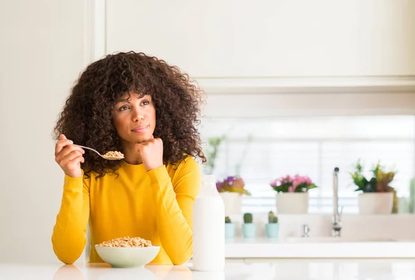 African American Woman Eating Cereals Milk Home Serious Face Thinking — Stock Photo, Image