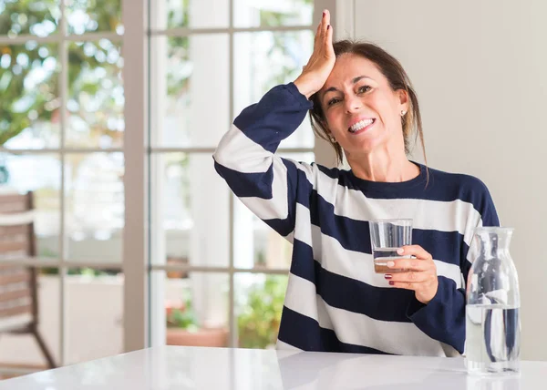 Middle Aged Woman Drinking Glass Water Stressed Hand Head Shocked — Stock Photo, Image