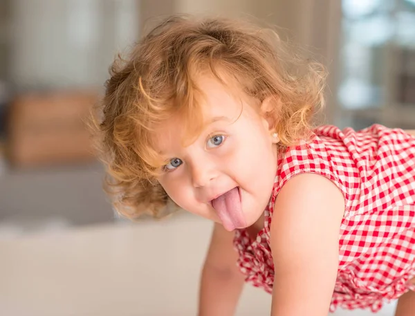 Beautiful Blonde Child Blue Eyes Smiling Tongue Out Home — Stock Photo, Image