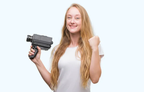 Blonde Woman Teenager Filming Holding Super Video Camera Screaming Proud — Stock Photo, Image