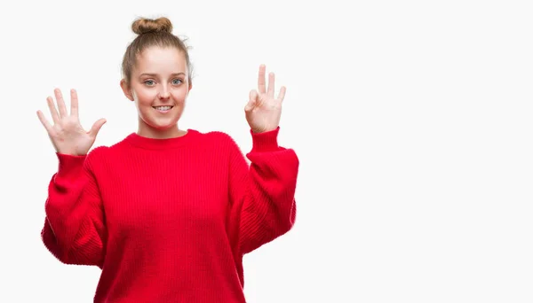 Junge Blonde Frau Dutt Und Rotem Pullover Zeigt Und Zeigt — Stockfoto