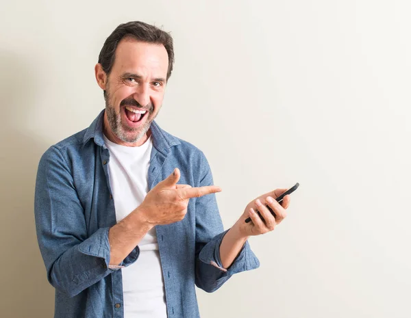 Senior Man Using Smartphone Very Happy Pointing Hand Finger Side — Stock Photo, Image