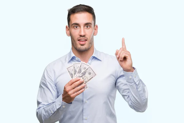 Schöner Junger Mann Mit Geld Überrascht Mit Einer Idee Oder — Stockfoto