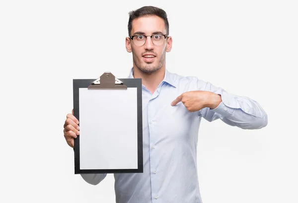 Handsome Young Business Man Showing Clipboard Surprise Face Pointing Finger — Stock Photo, Image