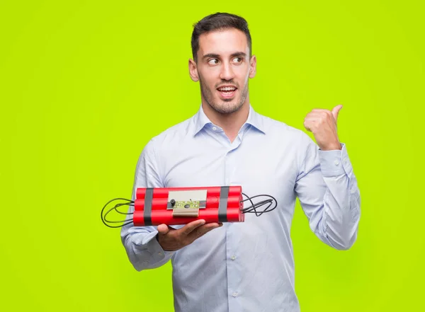 Handsome Young Business Man Holding Alarm Clock Bomb Pointing Hand — Stock Photo, Image