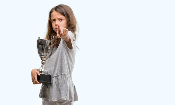 Brunette Hispanic Girl Holding Trophy Pointing Finger Camera You Hand — Stock Photo, Image