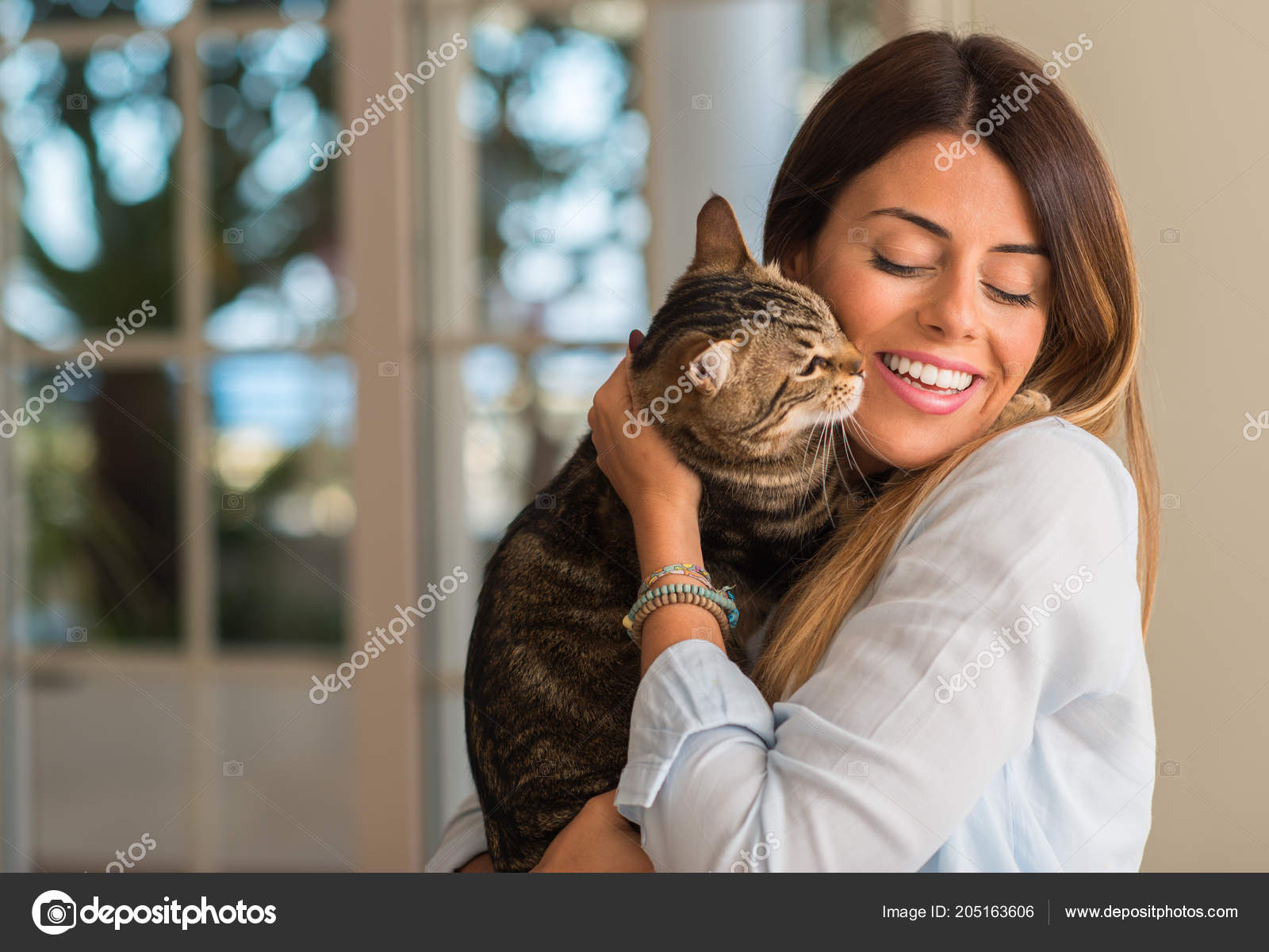 Young Beautiful Woman Smiling Cuddling Cat Love Home Stock Photo By C Krakenimages Com 205163606