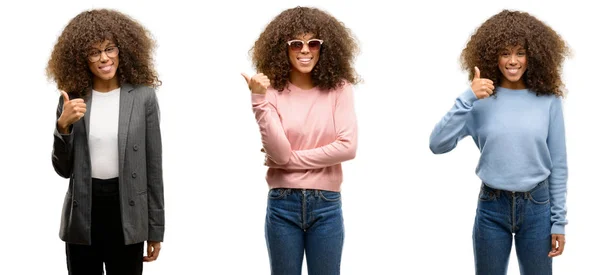 非洲裔美国年轻女子穿着不同的服装 用手做着快乐的拇指手势 批准表达式看相机与显示成功 — 图库照片