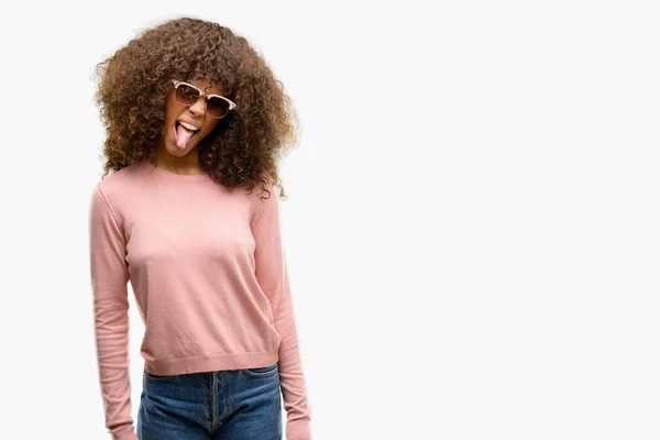 African American Woman Wearing Pink Sunglasses Sticking Tongue Out Happy — Stock Photo, Image