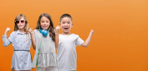 Group Boy Girls Kids Orange Background Screaming Proud Celebrating Victory — Stock Photo, Image