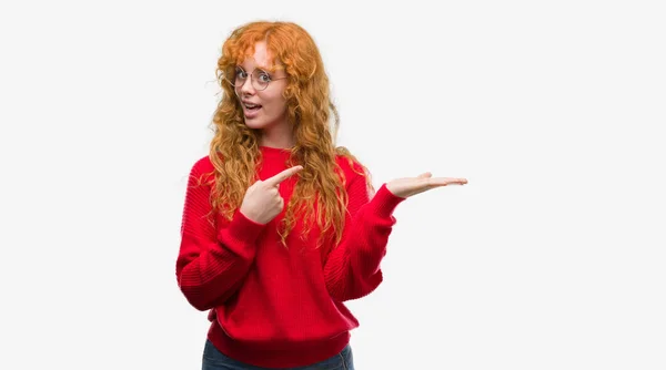 Young Redhead Woman Wearing Red Sweater Amazed Smiling Camera While — Stock Photo, Image