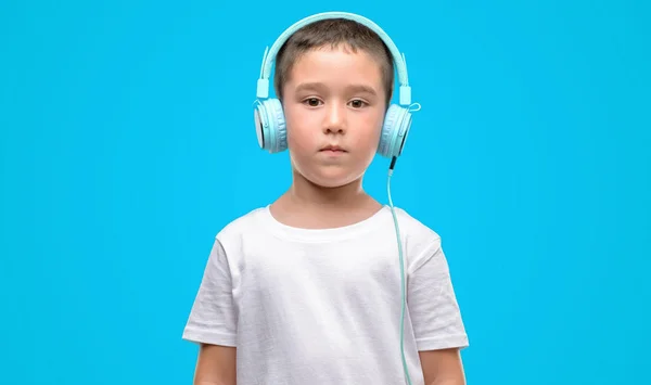 Dark Haired Little Child Listening Music Headphones Confident Expression Smart — Stock Photo, Image