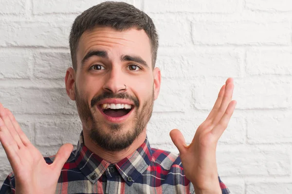 Homem Adulto Jovem Sobre Parede Tijolo Branco Muito Feliz Animado — Fotografia de Stock