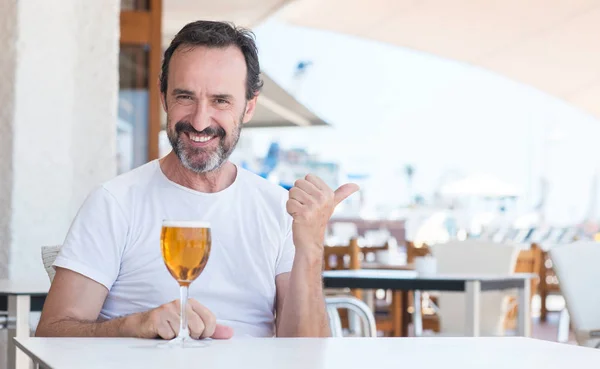 Handsome Senior Man Drinking Beer Restaurant Pointing Hand Finger Happy — Stock Photo, Image