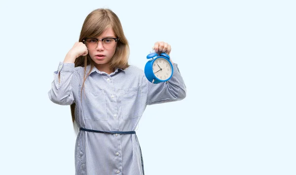 Young Blonde Child Holding Alarm Clock Annoyed Frustrated Shouting Anger — Stock Photo, Image