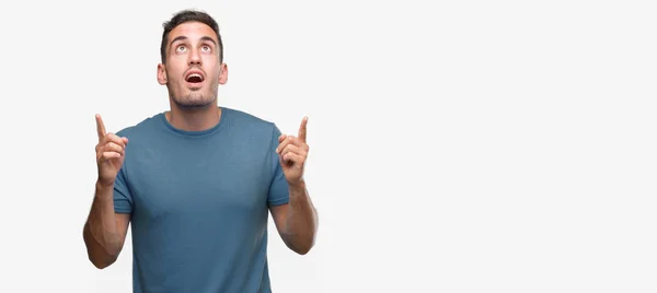 Handsome Young Casual Man Amazed Surprised Looking Pointing Fingers Raised — Stock Photo, Image