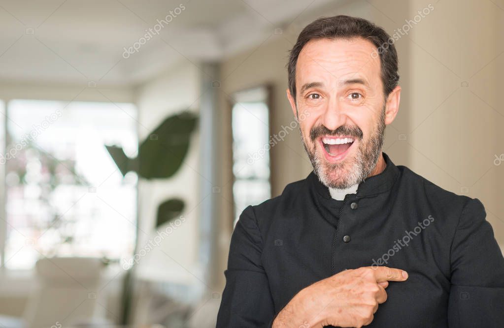 Christian priest man with surprise face pointing finger to himself