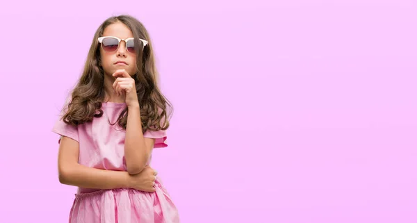 Brunette Hispanic Girl Wearing Sunglasses Serious Face Thinking Question Very — Stock Photo, Image