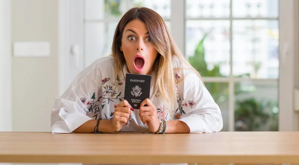Young Woman Home Holding Passport United States Scared Shock Surprise — Stock Photo, Image