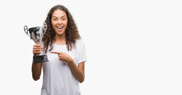 Young Hispanic Woman Holding Trophy Very Happy Pointing Hand Finger — Stock Photo, Image