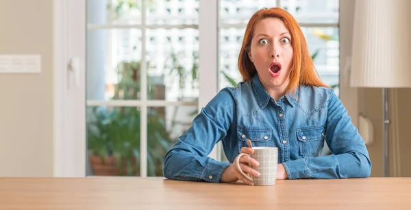 Redhead Woman Holding Cup Coffee Scared Shock Surprise Face Afraid — Stock Photo, Image