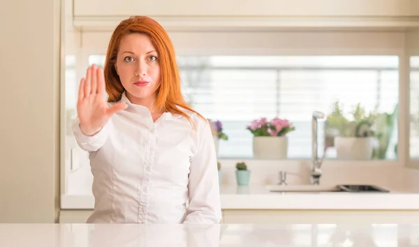 Redhead Woman Kitchen Doing Stop Sing Palm Hand Warning Expression — Stock Photo, Image