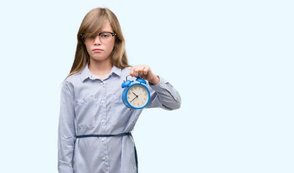 Young Blonde Child Holding Alarm Clock Confident Expression Smart Face — Stock Photo, Image